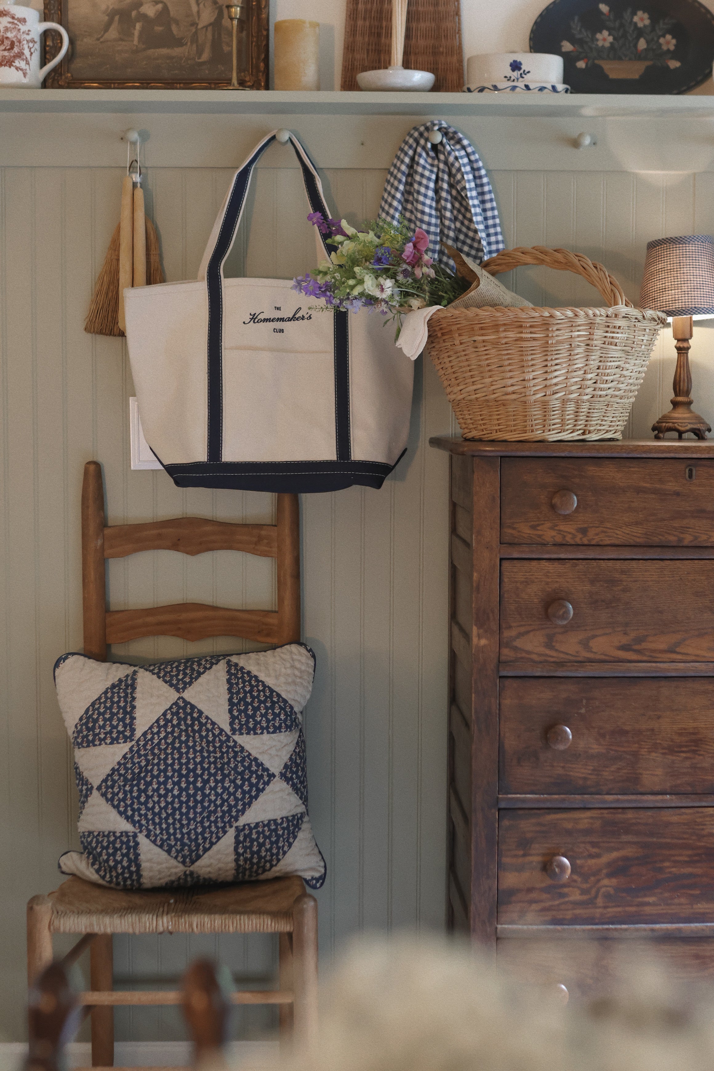 The Everyday Tote, a natural canvas boat tote with navy trim from The Homemaker's Club.