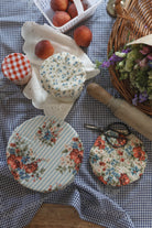 Set of three reusable cotton bowl covers in blue and red floral prints