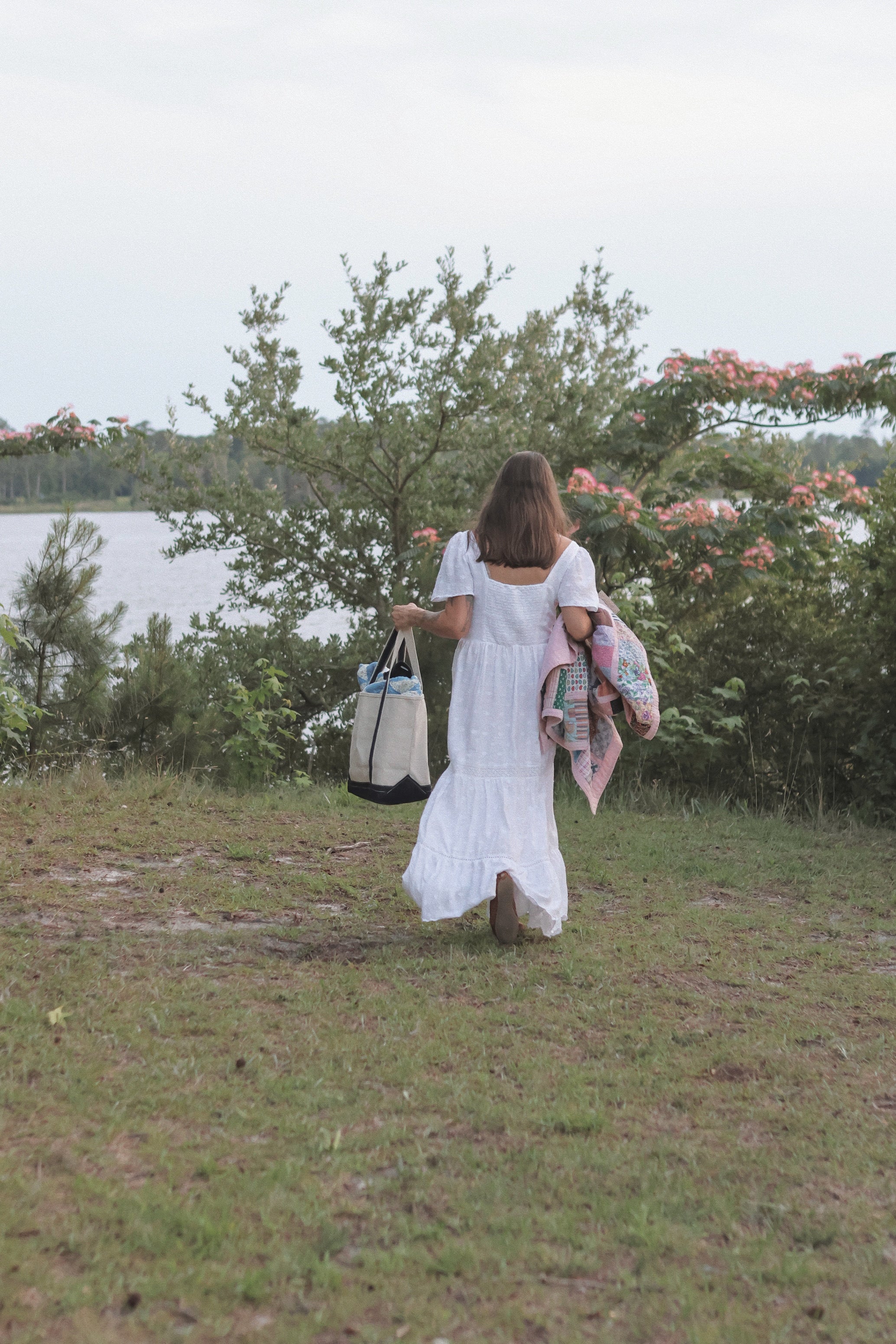 The Everyday Tote, a natural canvas boat tote with navy trim from The Homemaker's Club.